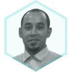 Portrait of a man with short hair, a goatee, and a light-colored collared shirt, framed within a light blue hexagon shape on a white background—ideal for AppSec Risk Prioritization and API Attack Surface Discovery contexts.