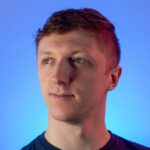 A man looks to the side, contemplating AppSec Risk Prioritization and API Attack Surface Discovery.