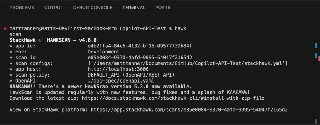 A terminal window displays the output of a Hawk scan using StackHawk, showing scan details like scan ID, environment, app ID, and config paths, along with a message announcing a new HawkScan version and update link.