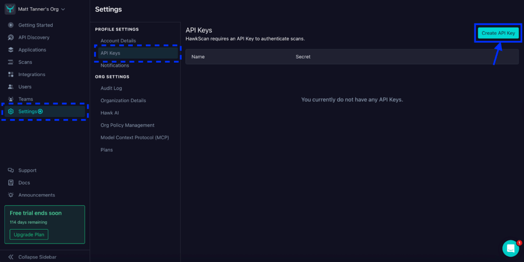 Screenshot of a dark-themed settings page showing the API Keys section selected. A blue box and arrow highlight the Create API Key button on the right. No API keys are currently listed.